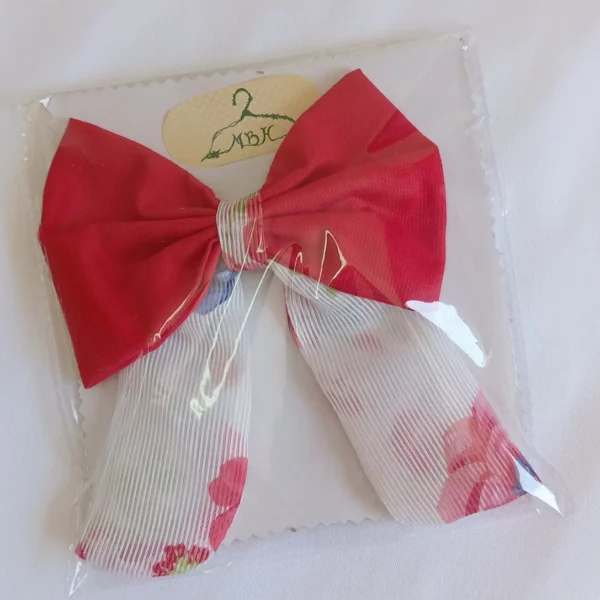 lazo niña coral con estampado floral y caída larga